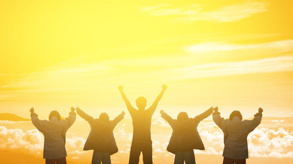 people silhouette hand up show with sunset background