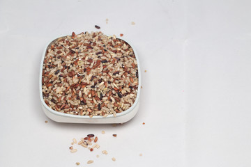 Raw brown rice isolated on white