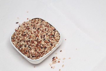 Raw brown rice isolated on white