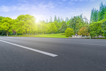 Asphalt road square and river hill under the blue sky