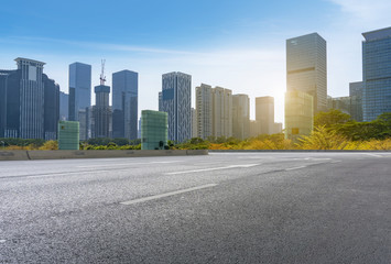 Fototapeta na wymiar empty road with panoramic cityscape