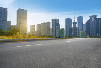 Fototapeta na wymiar empty road with panoramic cityscape