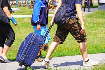 Obraz premium People walk on the street with luggage