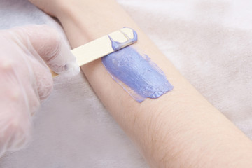 purple wax arm depilation