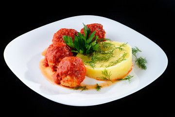 Fried chicken meatballs with glaze and mashed potato on the plat
