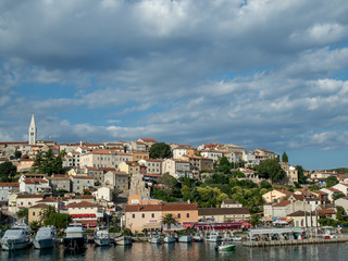 Fototapeta na wymiar Vrsar, Croatia, Europe, June 2018. View from city port to Saint Martin's Church.