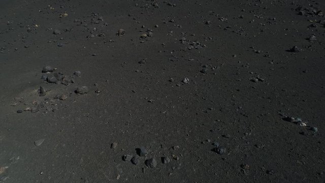 Aerial drone scene of detail of volcano with black dark lapillis rocks and lava. pumps Malargüe, La Payunia National Park, Cuyo, Mendoza.