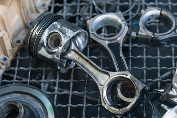 Old pistons and connecting rods, main parts for an internal combustion engine.
at garage - spare parts. 