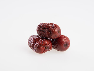 Dates or chinese red dates on a background.