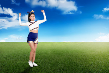 Young asian cheerleader performing