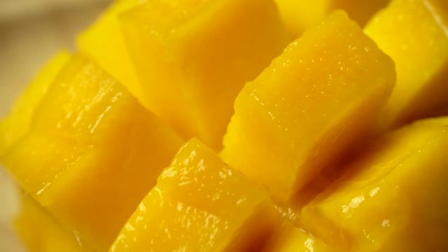 Rotation of rip mango slice cubes cut