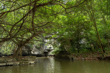 Fototapeta na wymiar Touristic boat ride in Hao Lu in Ninh Binh city, Vietnam.It is a famous national park with its rivers and the caves.