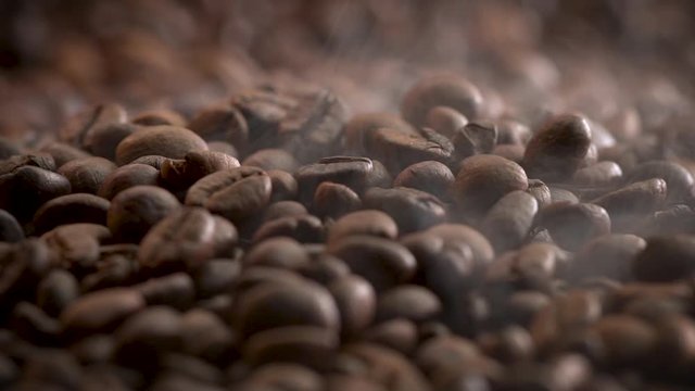Brown Coffee beans with steam loop video HD 