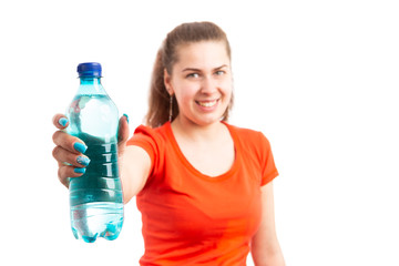 Young attractive woman offering bottle of water.