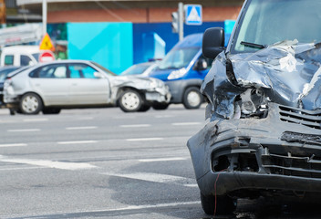car crash accident on street, damaged automobiles after collision in city