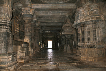 Fototapeta na wymiar Long passage covered with various kinds of pillars adjoining both, the Shantaleshwara and Hoysaleshvara shrine, Hoysaleshvara Temple, Halebid, Karnataka