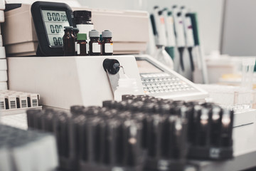 Prescription. Selective focus of medicine bottles with modern equipment in well equipped laboratory room
