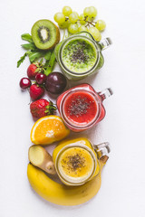 Fototapeta na wymiar Set of fruits and berries smoothies on a white background