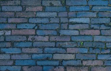 Fototapeta premium Abstract background of granite old cobblestone pavement. Paving 