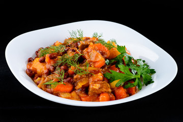 Goulash, delicious beef stew with potatoes, carrots and herbs on