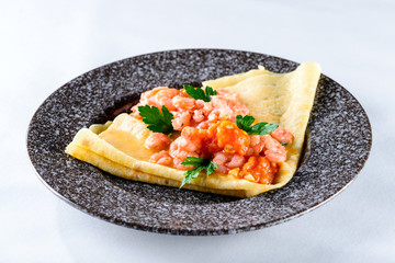 Delicious pancake blini with shrimps