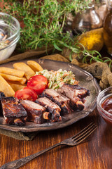 Spicy barbecued pork ribs with french fries