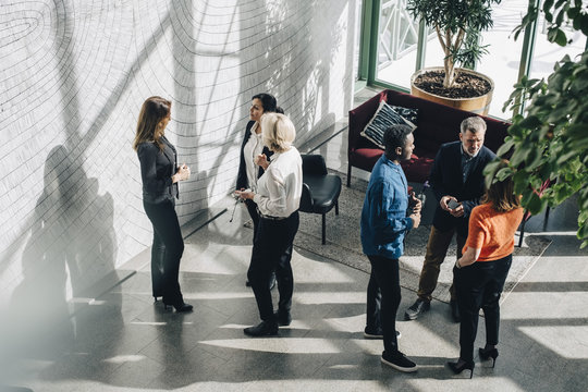 Business people talking in lobby