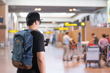 young man at the airport terminal Traveling concept travelling people