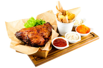 Juicy fried chicken with French fries on the wooden board isolat