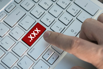  XXX button, on keyboard ,Watching pornography on a computer. Internet Masturbation.
