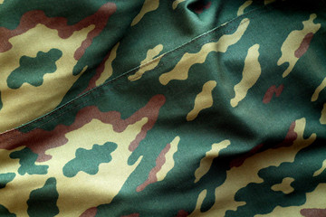 Military uniform pattern with blur effect.