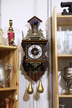 Antique wall clock with pendulum