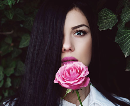 Young Woman Holding Rose Flower