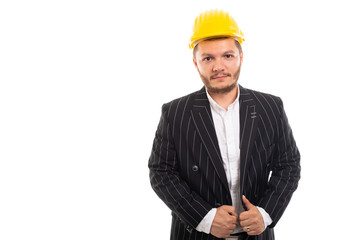 Portrait of business man in safety yellow helmet.