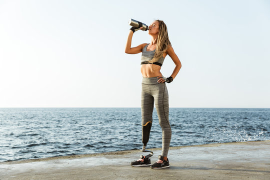 Full Length Of Young Disabled Athlete Woman