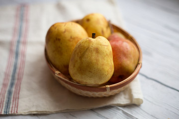 Naklejka na ściany i meble Fruit background. Fresh organic pears on old wood. Pear autumn harvest