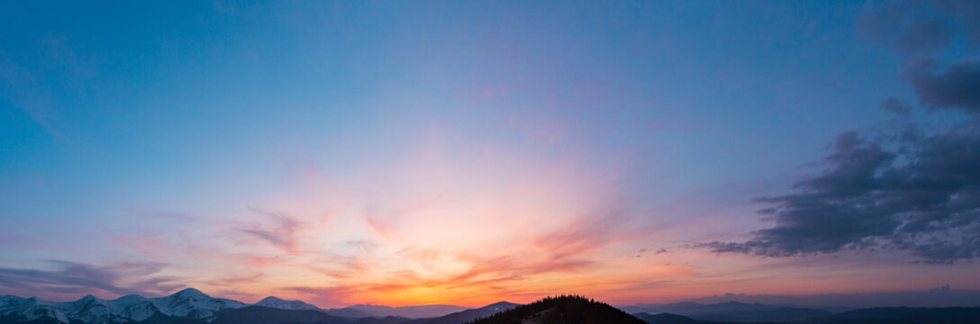 Fototapeta Sunset sky above mountains