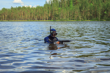 Underwater hunter  preparing to dive.