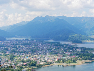 Scenery of Lake Kawaguchi, the biggest lake of Fuji five lakes, with view of Fujikawaguchiko or Kawaguchiko town and mt Kurodake on the background, famous tourist destination in Japan