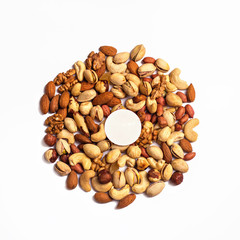 Nuts and dried fruits on a white background. Photo for the catalog. Place for logo, your text.