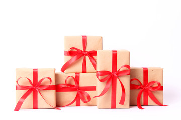 lots of gifts with red ribbon isolated on white. Holiday, minimalism, giving