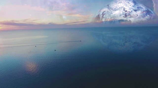 Aerial cinemagram - calm ocean waters on alien planet under stars with fishing boat sailing across the frame at sunset.  Elements of this work are furnished by NASA