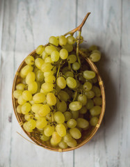 Grapes on white wooden vintage table