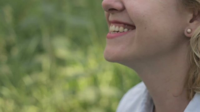 Little, pretty girl thanking mother by kissing her on cheek. Happy motherhood.