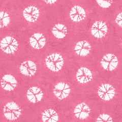 Seamless pattern, abstract tie dyed fabric of pink color on white cotton. Hand painted fabrics. Shibori dyeing