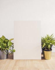 Blank white Photo Frame on Wooden for Design Mockup Template.