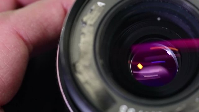 Adjusting aperture of a photo camera lens