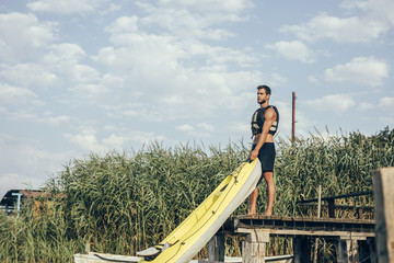 Kayakers Holding Kayak