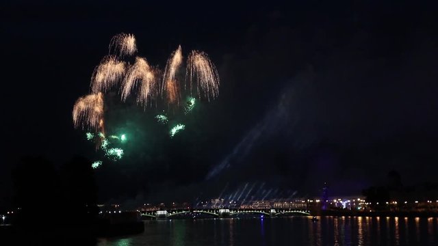 Fireworks at Scarlet Sails celebration event during FIFA World Cup 2018 Championship in Saint-Petersburg when Red Sails Ship comes to Neva Water Area during White Nights shot from Tuchkov Bridge