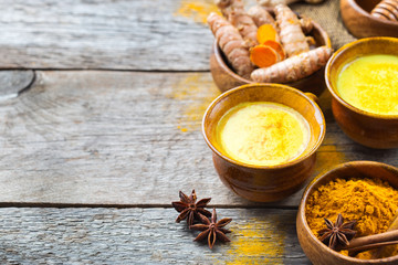 Traditional indian drink turmeric curcuma golden milk with ingredients